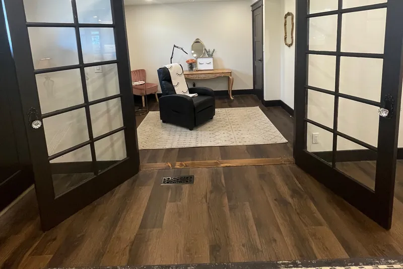 The treatment room seen through open French doors