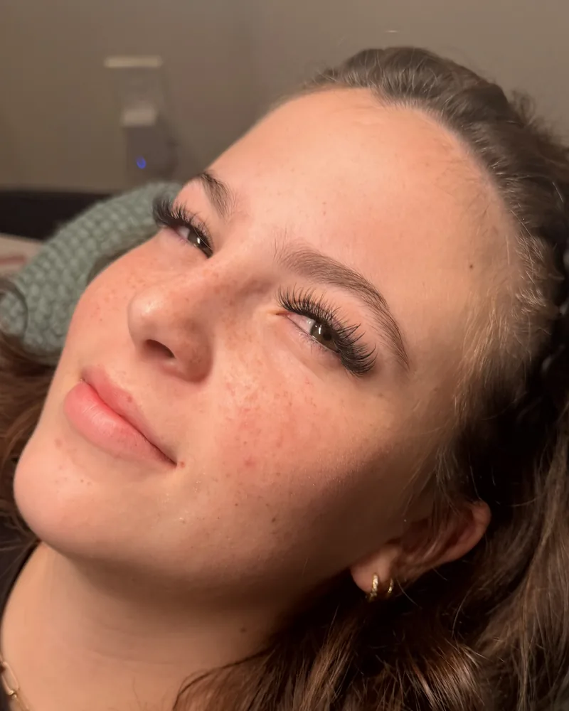 A Sage & Lash client with a soft, fluffy hybrid lash set